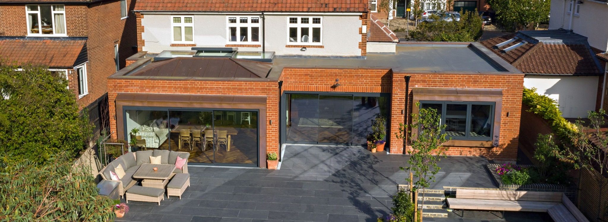 Completed rear extension and landscaped terrace on a Cheshire home