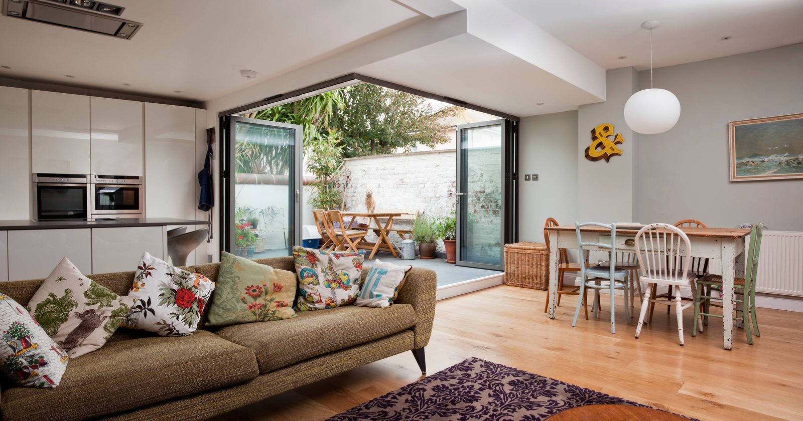 Open-plan kitchen renovation with wall removed and new steel